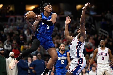NBA 2024-25: Magic forward Paolo Banchero (5) looks to pass the ball