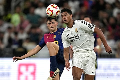 Spanish Super Cup 2025 Final: Barcelona's Pedri challenges for the ball with Real Madrid's Jude Bellingham