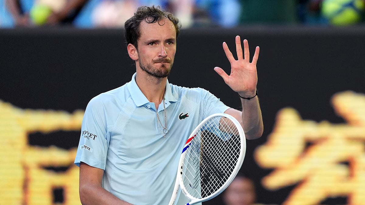 AP Photo/Ng Han Guan : Daniil Medvedev of Russia waves after defeating by Kasidit Samrej of Thailand in their first round match at the Australian Open tennis championship in Melbourne, Australia, Tuesday, Jan. 14, 2025.