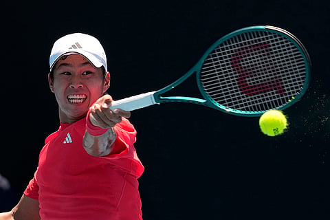 Australian Open 2025: Learner Tien plays a forehand return to Camilo Ugo Carabelli