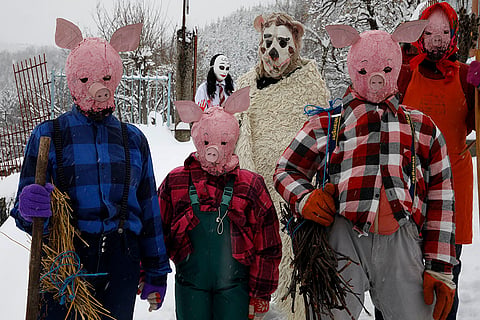 Masked revelers during Vevchani Carnival 