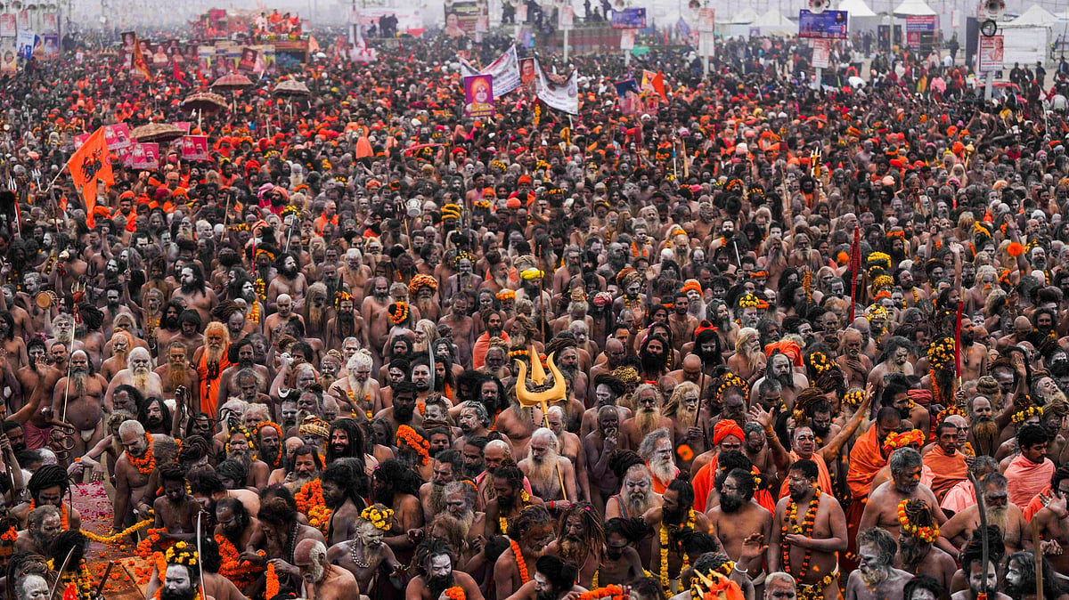 Naga Sadhus of Shri Panchayati Niranjani Akhada arrive to take a holy dip during the first 'Amrit Snan' at the Mahakumbh on the Makar Sankranti festival, at Sangam in Prayagraj, Tuesday, Jan. 14, 2025.  - PTI