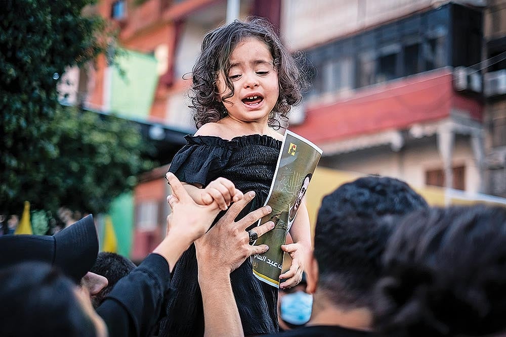The image of a young girl clicked at her father’s funeral in Beirut 