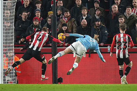 EPL 2024-25: Manchester City's Erling Haaland dives for the ball 