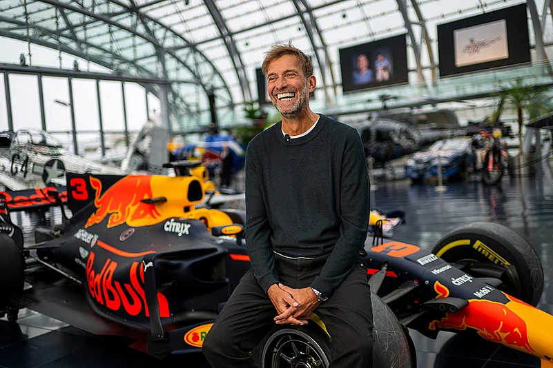 Jurgen Klopp Poses With Red Bull F1 cars in Salzburg
