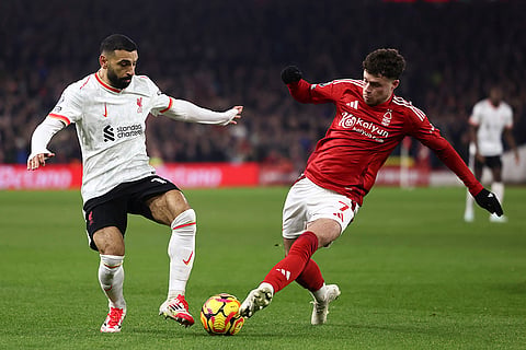 EPL 2024-25: Liverpool's Mohamed Salah duels for the ball with Nottingham Forest's Neco Williams 