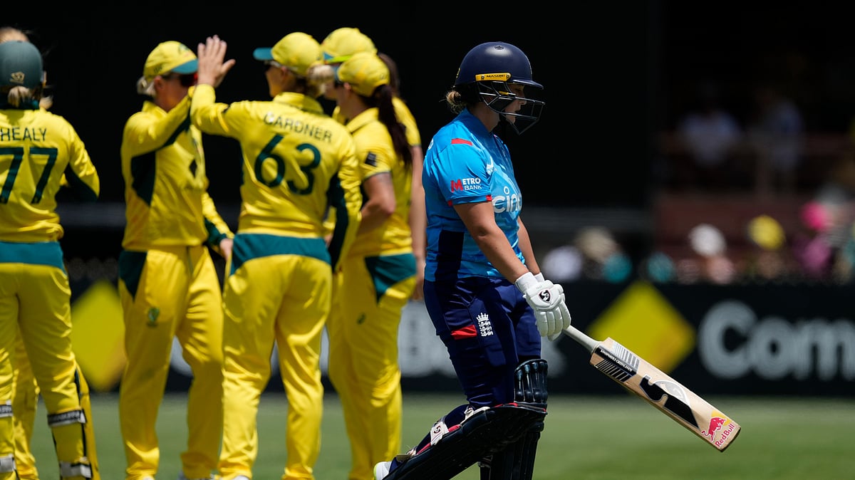 AP Photo/Rick Rycroft : England's Alice Capsey, right, walks off after she is caught out by Australia's Ashleigh Gardner during their Women's Ashes one-day international cricket match in Sydney.