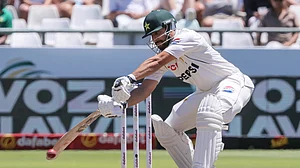 AP Photo/Halden Krog : Pakistan's Salman Agha plays a shot during the fourth day of the second test match between South Africa and Pakistan in Cape Town.