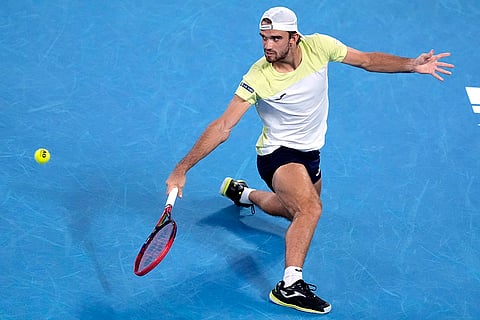 Australian Open 2025: Tomas Machac plays a backhand return to Novak Djokovic