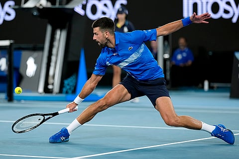 Australian Open 2025: Novak Djokovic plays a backhand return to Tomas Machac