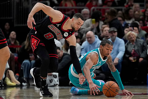 NBA 2024-25: Bulls guard Zach LaVine (8), left, grabs a loose ball from Hornets guard Nick Smith Jr. 