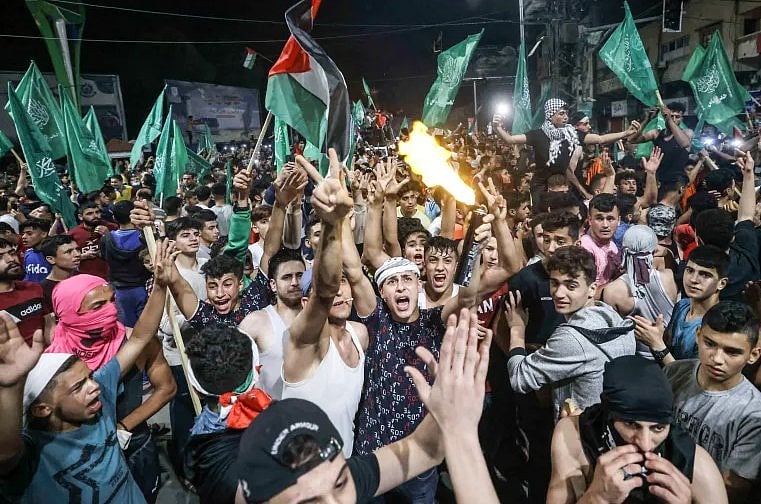 Gazan people celebrate as Israel cabinet approves ceasefire deal - X/@realzaidzayn