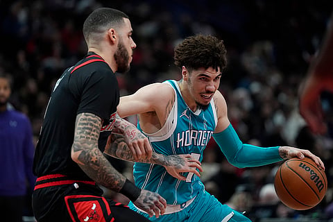 NBA 2024-25: Bulls guard Lonzo Ball guards against Hornets guard LaMelo Ball 