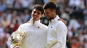 Carlos Alcaraz and Novak Djokovic after the Wimbledon final last year