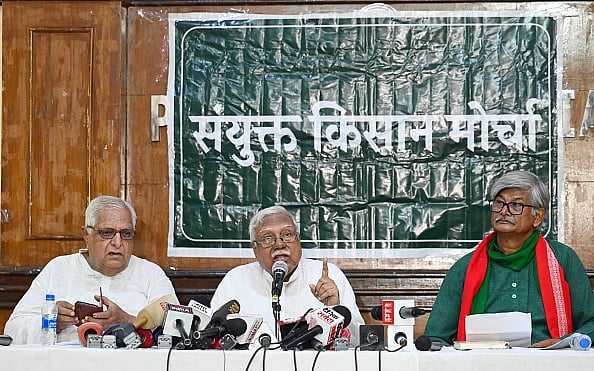 Getty Images : Samyukta Kisan Morcha (SKM) Hannan Mollah with Sunilam addressing media personnel at Press Club of India in July 2024