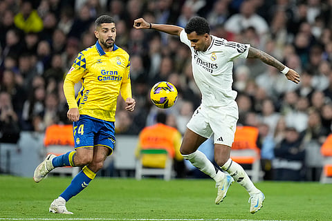 La Liga 2024-25: Rodrygo controls a ball chased by Alex Suarez 