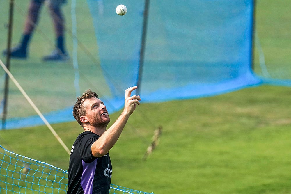 | Photo: AP/Bikas Das : IND vs ENG 1st T20, England Training session: England's captain Jos Buttler tosses a ball 