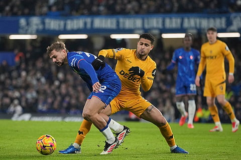 EPL 2024-25: Chelsea's Kiernan Dewsbury-Hall duels for the ball with Wolves Joao Gomes