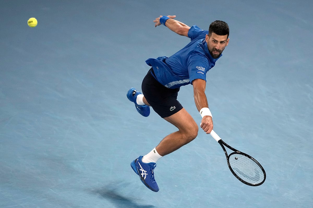 Novak Djokovic of Serbia plays a backhand return