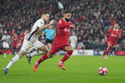 Champions League 2024–25: Mohamed Salah challenges for the ball with Gabriel Gudmundsson 