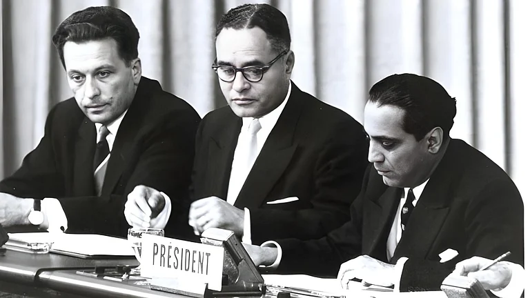 At the closing session of the International Conference on the Peaceful Uses of Atomic Energy (opened on 8 August) are (left to right): Ilya S. Tchernychev, Dr. Ralph J. Bunche, and Dr. Homi J. Bhabha (India), Conference President - null
