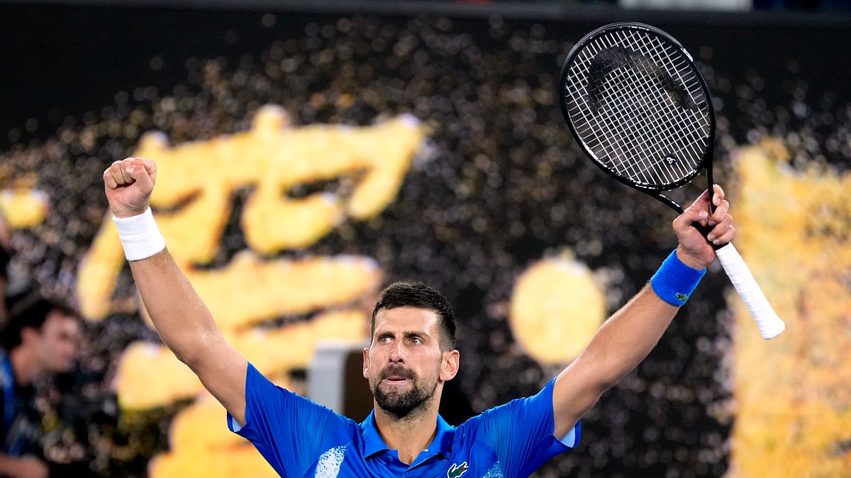 AP Photo/Asanka Brendon Ratnayake : Novak Djokovic of Serbia celebrates after defeating Carlos Alcaraz of Spain in their quarterfinal match at the Australian Open tennis championship in Melbourne.