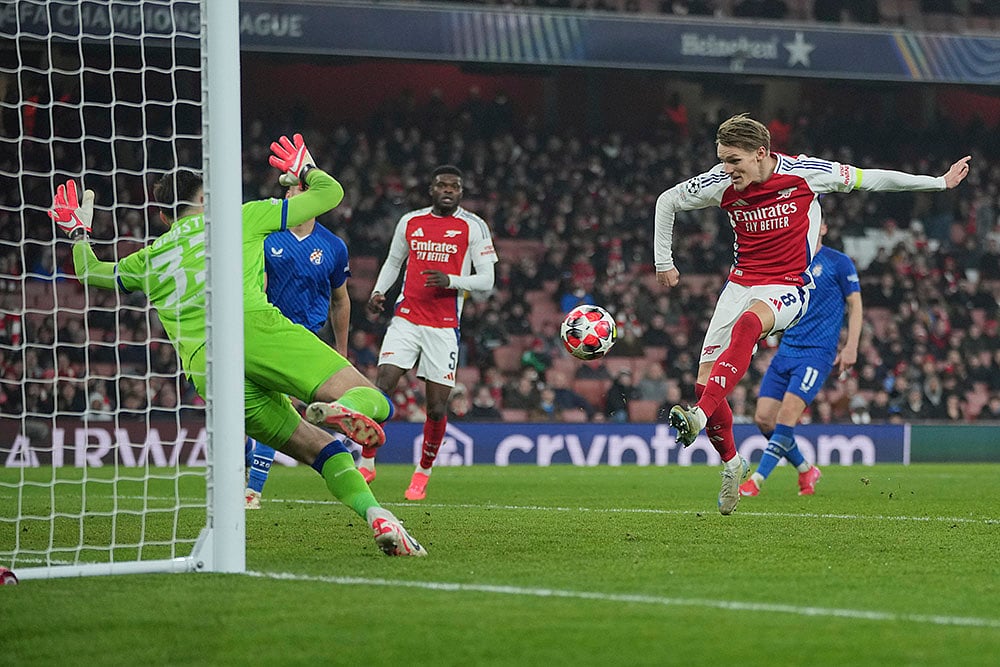 | Photo: AP/Kin Cheung : Champions League 2024-25: Arsenal's Martin Odegaard scores his side's third goal 