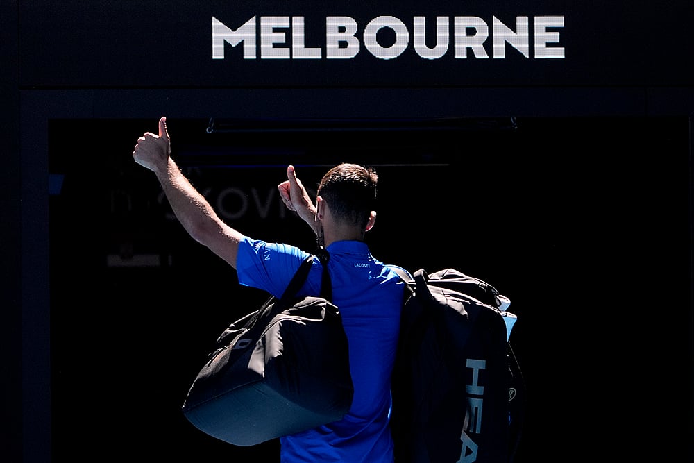 | Photo: AP/Asanka Brendon Ratnayake : AUS Open 2025 Men's Singles Semi-final: Novak Djokovic gestures as he leaves Rod Laver Arena after retiring 