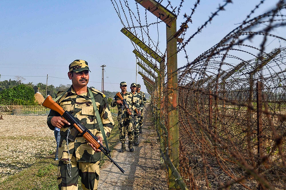 BSF personnel patrol along the India-Bangladesh border