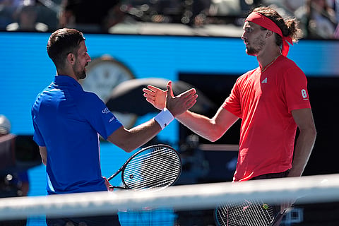 AUS Open 2025 Men's Singles Semi-final: Alexander Zverev, right shakes hands with Novak Djokovic