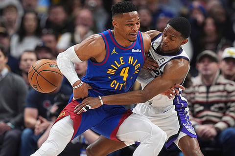 NBA Basketball 2024-25: Kings guard De'Aaron Fox knocks away the ball from Nuggets Russell Westbrook