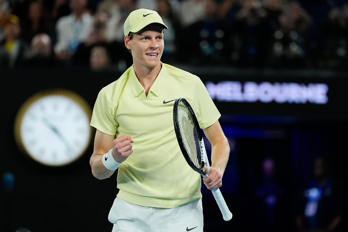 (AP Photo/Ng Han Guan) : Jannik Sinner of Italy celebrates after defeating Ben Shelton of the U.S. in their semifinal match at the Australian Open tennis championship in Melbourne, Australia, Friday, Jan. 24, 2025. 