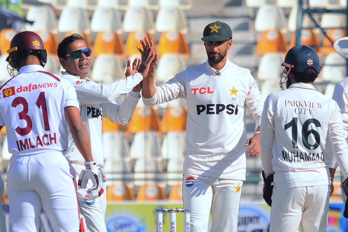 (AP Photo/Asim Tanveer) : Pakistan's Noman Ali, second left, celebrates with teammates after taking the wicket of West Indies Justin Greaves during the day-one of the second cricket test match between Pakistan and West Indies, in Multan, Pakistan, Saturday, Jan. 25, 2025. 