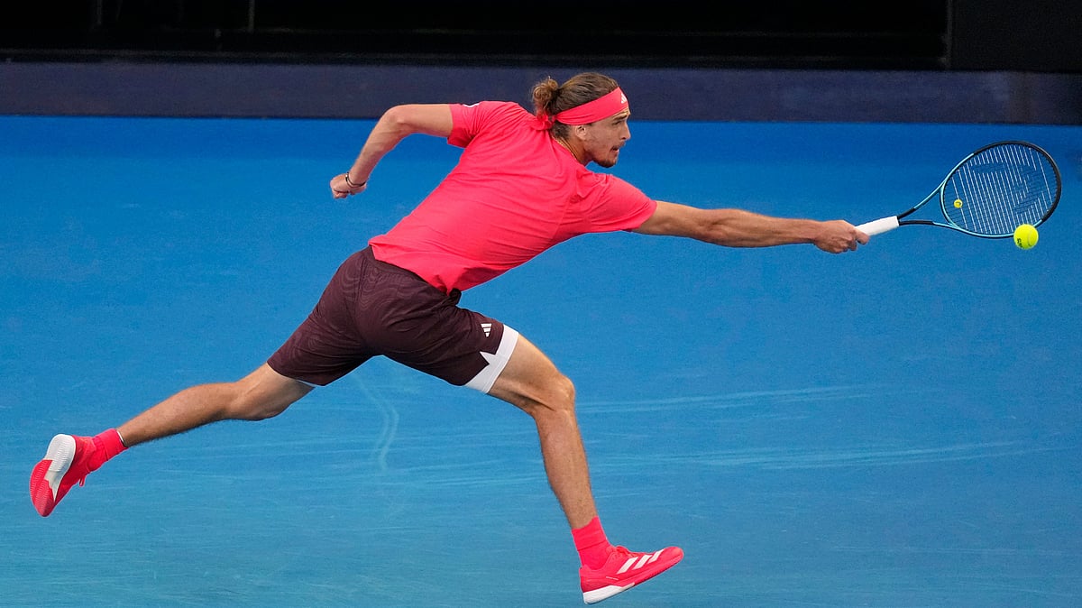 Vincent Thian/AP : Alexander Zverev of Germany plays a backhand to Jannik Sinner of Italy in the men's singles final at the Australian Open tennis championship in Melbourne, Australia, Sunday, Jan. 26, 2025