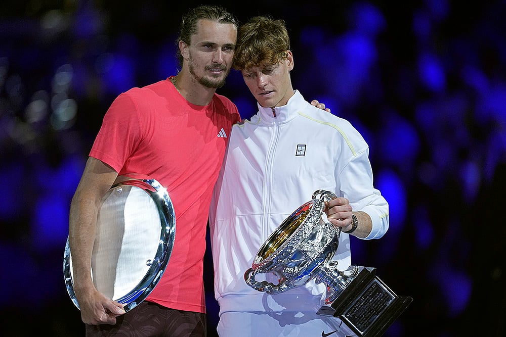 | Photo: AP/Ng Han Guan : Australian Open 2025: Jannik Sinner holds the Norman Brookes Challenge Cup after defeating Alexander Zverev of Germany