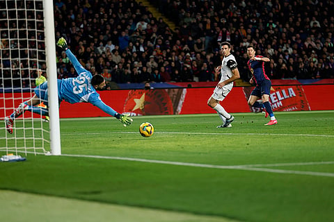 La Liga 2024-25: Robert Lewandowski, right, scores his side's sixth goal