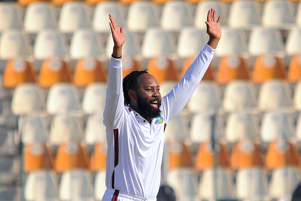 | Photo: AP/Asim Tanveer : PAK vs WI 2nd Test: West Indies Jomel Warrican appeals successful LBW dismissal of Pakistan's Salman Ali Agha 