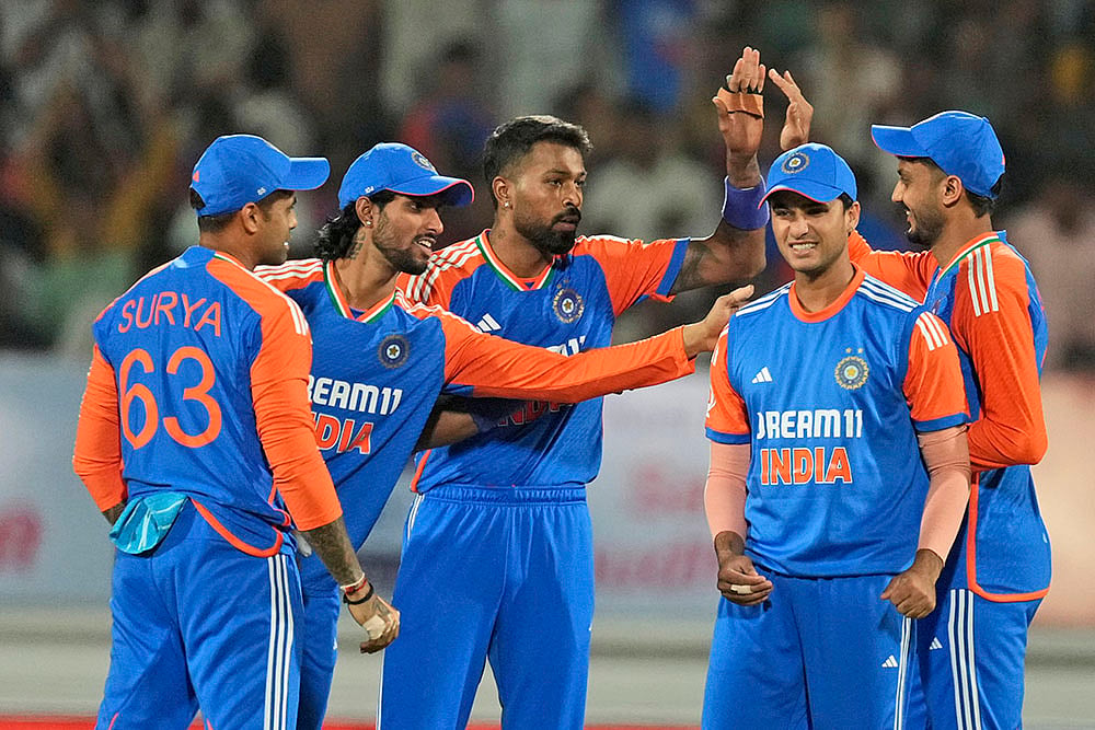 | Photo: AP/Ajit Solanki : IND vs ENG 3rd T20: India's Hardik Pandya celebrates with teammtes the wicket of England's Phil Salt