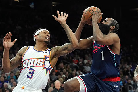 NBA 2024-25: Clippers guard James Harden (1) drives to the basket against Suns