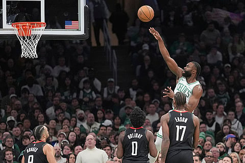 NBA 2024-25: Celtics guard Jaylen Brown shoots over the Rockets 
