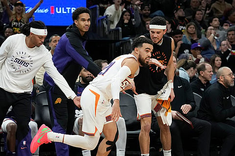 NBA 2024-25: Suns guard Tyus Jones, center, celebrates his 3-pointer