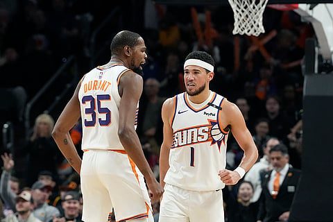 NBA 2024-25: Suns guard Devin Booker (1) celebrates his score against the Clippers 