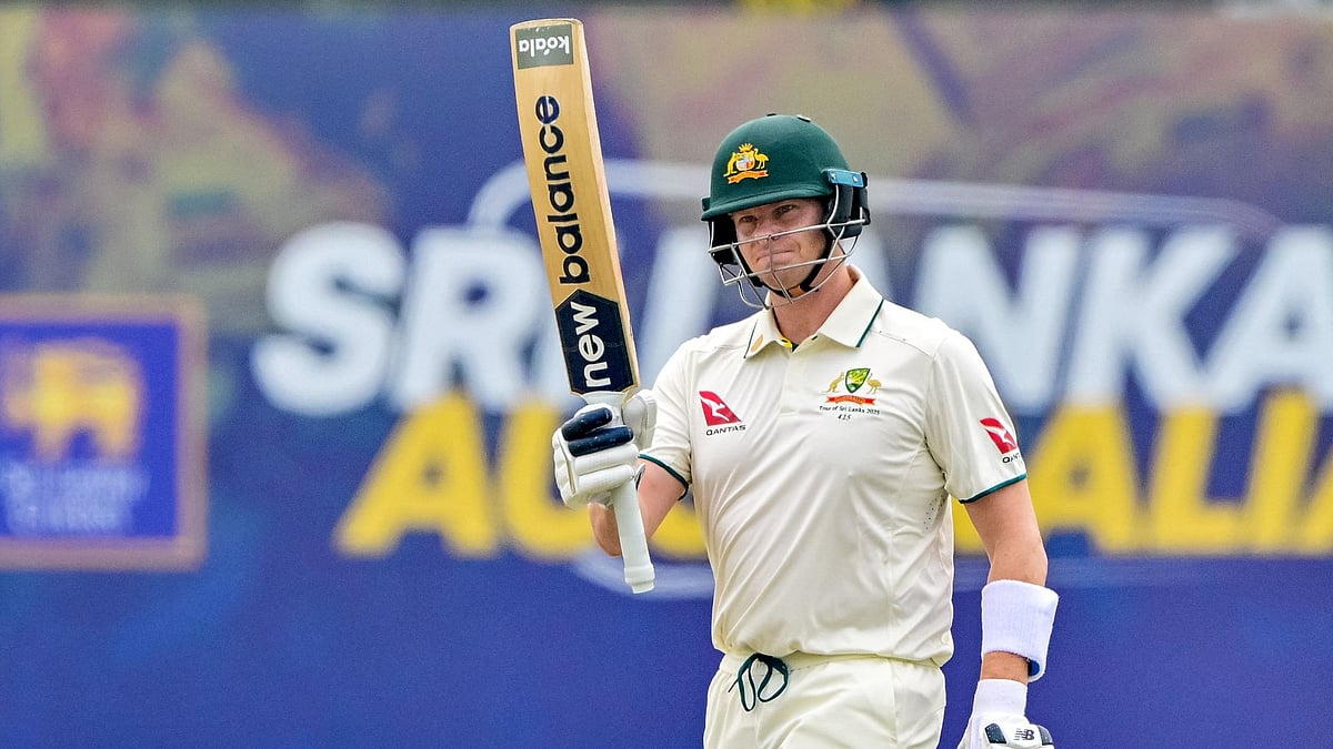 Smith salutes the crowd after notching his 10,000th Test run.