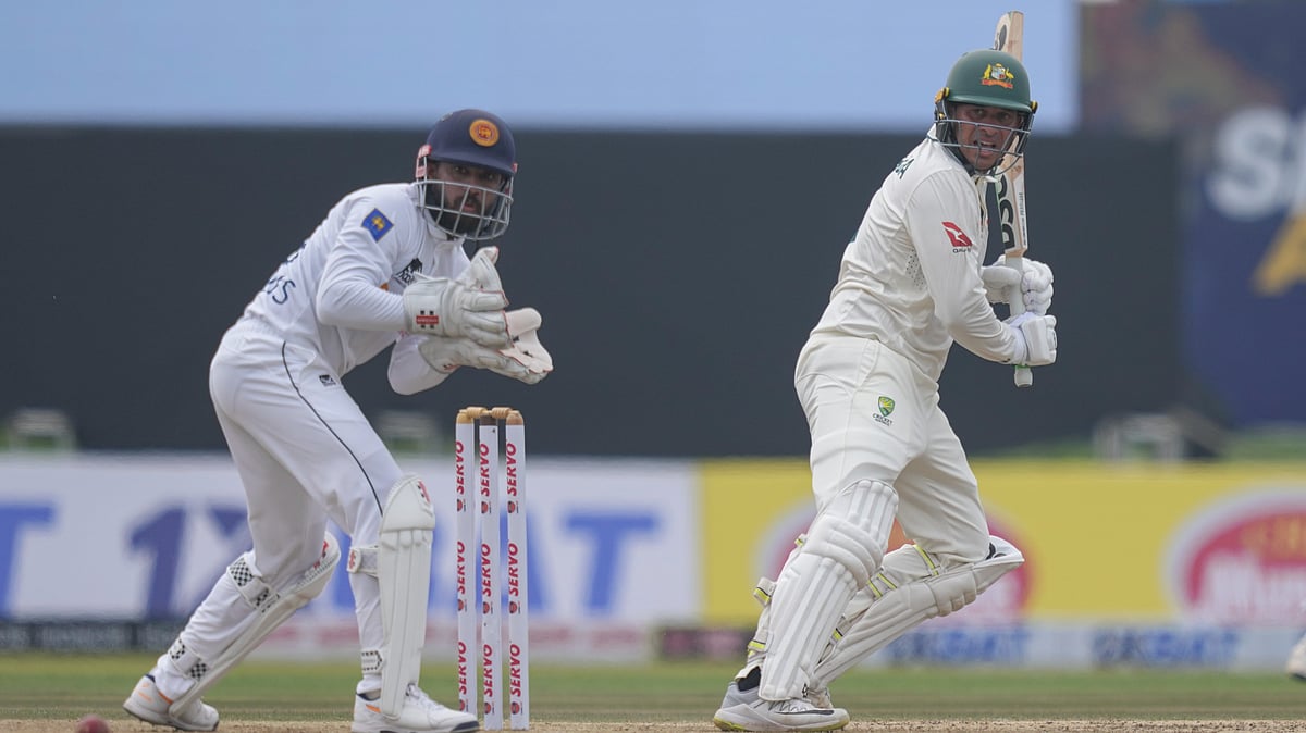 Photo: AP/Eranga Jayawardena : Australia's Usman Khawaja plays a shot as Sri Lanka's Kusal Mendis watches during day one of the first test cricket match between Sri Lanka and Australia in Galle, Sri Lanka, Wednesday, Jan. 29, 2025