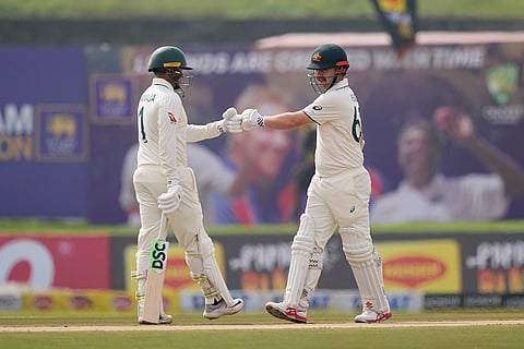 SL vs AUS 1st Test Day 1: Travis Head bumps fists with Usman Khawaja after hitting a four runs