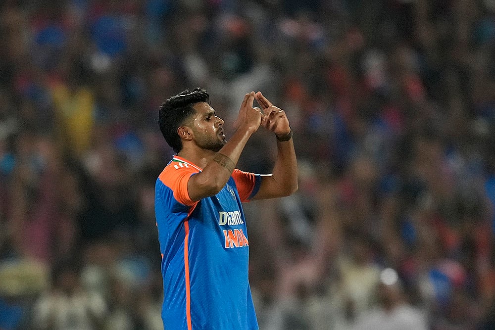 | Photo: AP/Rafiq Maqbool : India's Harshit Rana celebrates the wicket of England's Jacob Bethell during a T20 match