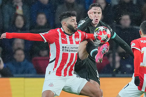Champions League 2024-25: PSV's Ismael Saibari and Liverpool's Federico Chiesa fight for the ball 