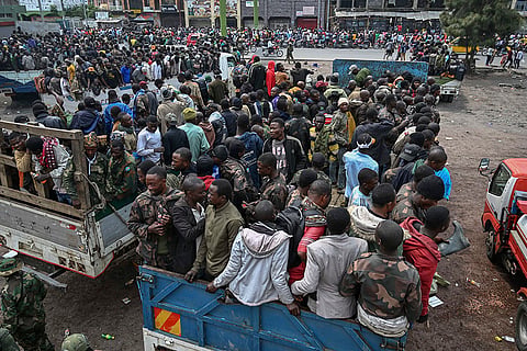 Congo conflict: M23 rebels escorting surrendered Congolese soldiers and police