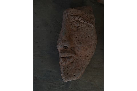 A face sculpture at PAMA Research Center in Pattanam, Kochi.