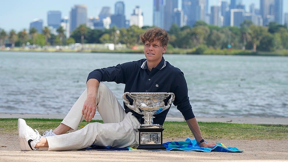 | Photo: AP/Mark Baker : Australian Open 2025 champion Jannik Sinner poses with Norman Brookes Challenge Cup.